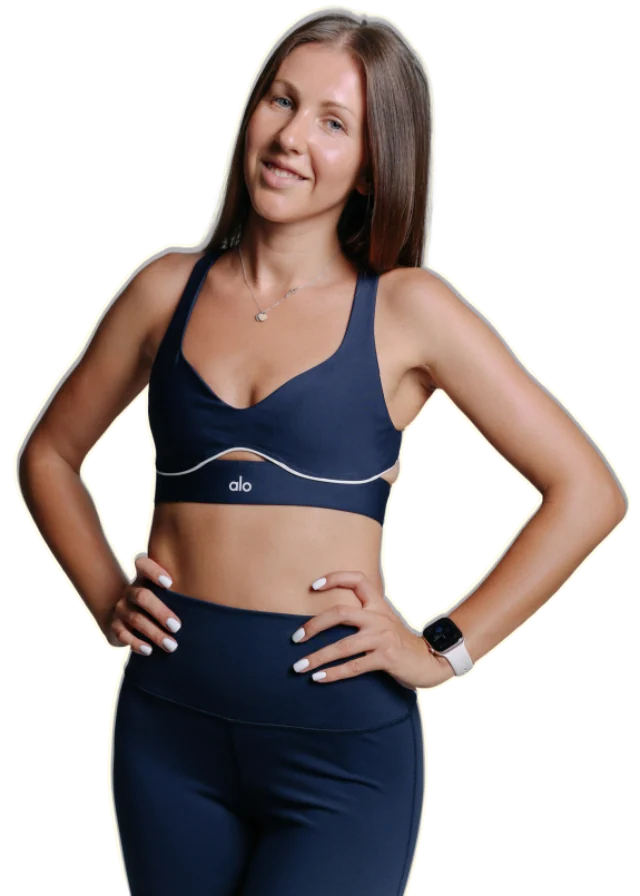 Liuba smiling with her hands on her hips